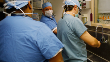 Surgical staff prepare for an operation (Reuters/Brian Snyder)