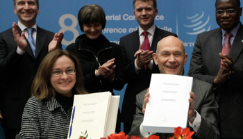 WTO Director general Pascal Lamy holds the signed document with Elvira Nabiullina, former Minister of Economic Development (Reuters/Denis Balibouse)