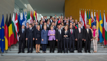 European officials pose for a family picture at an EU conference (Reuters/Thomas Peter)