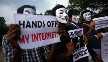 Anonymous India group of hackers wear Guy Fawkes masks as they protest against laws they say gives the government control over censorship of internet (Reuters/Vivek Prakash)