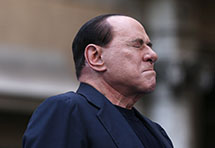 Former Italian Prime Minister Silvio Berlusconi closes his eyes (Reuters/Alessandro Bianchi)