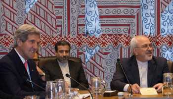 John Kerry and Mohammad-Javad Zarif are seated during a meeting (Reuters/Brendan McDermid)