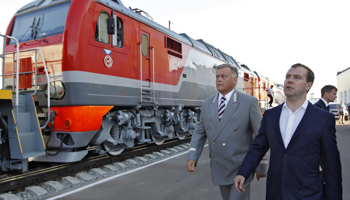 Prime Minister Dmitry Medvedev walks with Vladimir Yakunin, CEO of the Russian Railways (Reuters/Dmitry Astakhov/RIA Novosti/Pool)