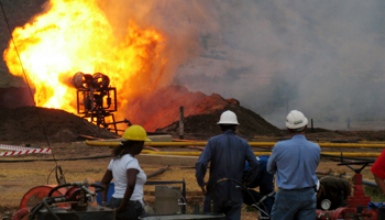 Workers undertake the first flaring test at the Waraga 1 well in western Uganda (Reuters/Hardman photo/Handout)