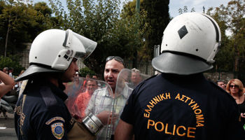 A school guard argues with the police during a protest in Athens (Reuters/Yorgos Karahalis)