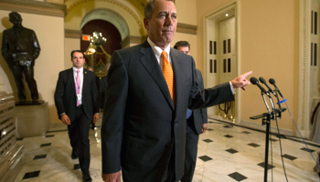 John Boehner walks to the House floor during the vote on the fiscal deal (Reuters/Kevin Lamarque)