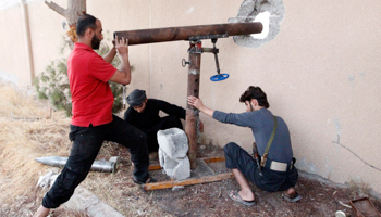 Free Syrian Army fighters prepare to fire rockets towards loyalist forces (Reuters/Nour Fourat)