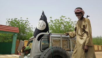 Fighters from the Islamic militant group the Movement for Unity and Jihad in West Africa (MUJAO) ride on a truck (Reuters/Adama Diarra)