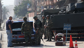 Lebanese army soldiers man a checkpoint after being deployed to tighten security in Tripoli (Reuters/Omar Ibrahim)