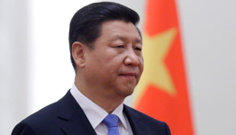 President Xi Jinping stands next to a Chinese national flag (Reuters/Jason Lee)