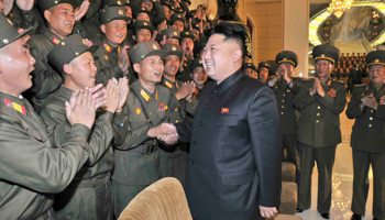 North Korean leader Kim Jong-un speaks with members of the audience (Reuters/KCNA)