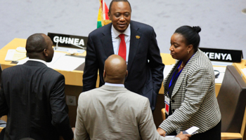 Kenya's President Uhuru Kenyatta talks to Kenyan delegates during the Extraordinary Session of the Assembly of Heads of State and Government of the African Union with the International Criminal Court (Reuters/Tiksa Negeri)
