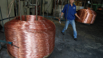 A worker labels copper products at Truong Phu cable factory in Vietnam's northern Hai Duong province (Reuters/Kham)