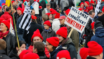 Protesters wearing red caps, the symbol of protest in Brittany, and with their regional flag, attend a demonstration to maintain jobs in Quimper (Reuters/Stephane Mahe)