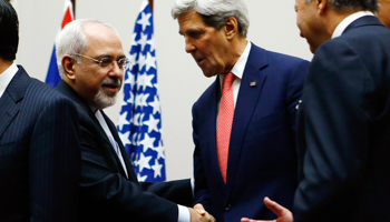 Secretary of State John Kerry shakes hands with Foreign Minister Mohammad Javad Zarif (Reuters/Denis Balibouse)