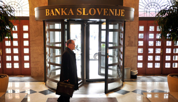 A man walks in the lobby of the national Bank of Slovenia in Ljubljana (Reuters/Srdjan Zivulovic)