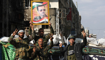 Security personnel loyal to Syria's President Bashar al-Assad in Hujaira (Reuters/Alaa Al-Marjani)