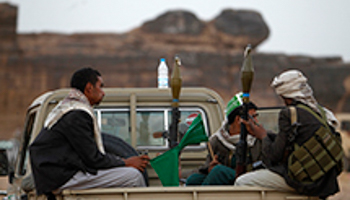 Armed followers of Yemen's Shi'ite Houthi group sit on a truck (Reuters/Khaled Abdullah)