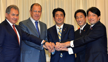 Russia's Foreign Minister Sergey Lavrov and Defence Minister Sergei Shoigu shakes hands with Japan's Prime Minister Shinzo Abe, Foreign Minister Fumio Kishida and Defense Minister Itsunori Onodera (Reuters/Yoshikazu Tsuno/Pool)