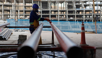 A labourer works at the site of the New Corinthians Stadium in Sao Paulo, Brazil (Reuters/INSERT ATTRIBUTION HERE)