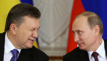President Viktor Yanukovich gives a wink to his Russian counterpart Vladimir Putin (Reuters/Sergei Karpukhin)