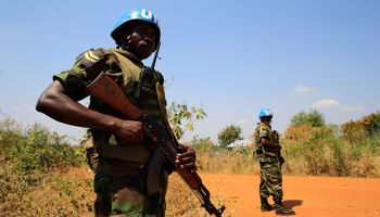 United Nations Mission in Sudan personnel guard South Sudanese people displaced by recent fighting (Reuters/James Akena)