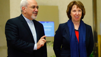 Catherine Ashton arrives with Foreign Minister Mohammad Javad Zarif during a photo opportunity in Geneva (Reuters/Denis Balibouse)