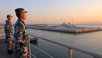 Chinese naval soldiers stand guard on China's first aircraft carrier Liaoning (Reuters/Stringer)