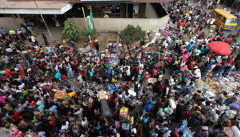 People crowd a street in Balogun market, in the central business district of Lagos (Reuters/Akintunde Akinleye)