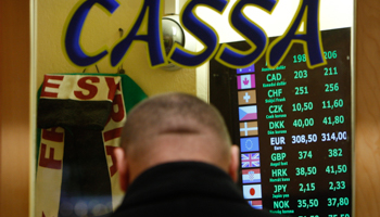 A customer waits to exchange money in Budapest (Reuters/Bernadett Szabo)