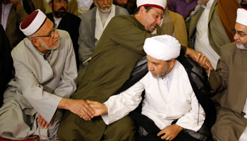 Iraqi Muslim worshippers shake hands during a joint Sunni-Shia Friday prayer in Baghdad, Iraq  (Reuters/Thaier al-Sudani)