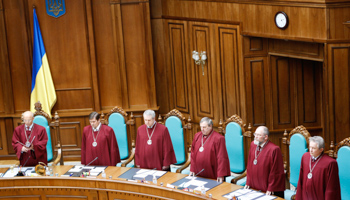 The former chairman of Ukraine's Constitutional Court reads out the court's rulings in Kiev (Reuters/Konstantin Chernichkin)