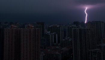 Lightning is seen above buildings during a storm in central Shanghai (Reuters/Aly Song)