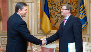 President Viktor Yanukovich shakes hands with EU enlargement commissioner Stefan Fule in Kiev (Reuters/Mykhailo Markiv/Ukraine's Presidential Press Service/Handout via Reuters)