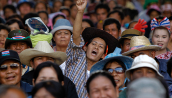 A farmer reacts as she takes part in a rally on the outskirts of Bangkok (Reuters/Chaiwat Subprasom)