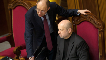 Newly-elected speaker of parliament Oleksander Turchinov speaks with opposition leader Arseny Yatsenyuk during a parliament session in Kiev (Reuters/Alex Kuzmin)