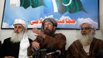 Maulana Sami ul-Haq, one of the Taliban negotiators, speaks during a news conference with his team members in Islamabad (Reuters/Mian Khursheed)