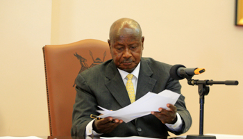 Uganda President Yoweri Museveni signs an anti-homosexual bill into law (Reuters/James Akena)