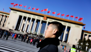 A Chinese soldier in plain clothes stands guard in front of the National People's Congress in Beijing (Reuters/Jason Lee)