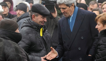 Secretary of State John Kerry meets with a Ukrainian man as he visits the Shrine of the Fallen in Kiev (Reuters/Valentyn Ogirenko)