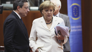 European Central Bank President Mario Draghi talks to Germany's Chancellor Angela Merkel (Reuters/Francois Lenoir)