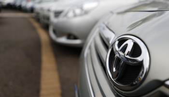 Toyota cars are lined up for sale on the forecourt of a Toyota dealer (Reuters/Andrew Winning)