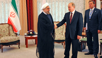 President Vladimir Putin meets his Iranian counterpart Hassan Rouhani at the Shanghai Cooperation Organization (SCO) summit in September 2013 (Reuters/Mikhail Klimentyev/RIA Novosti/Kremlin)