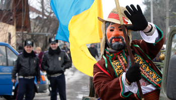 A man performs on a street in a Ukrainian village of the Carpathian mountains (Reuters/Gleb Garanich)