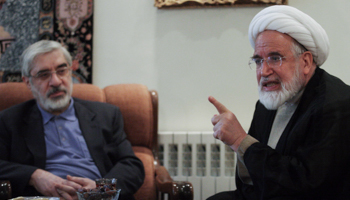 Mirhossein Mousavi meets with pro-reform cleric Mehdi Karoubi in Tehran (Reuters/Stringer)