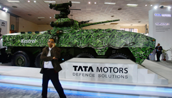 A visitor speaks in front of Tata Motors' Kestrel (Reuters/Anindito Mukherjee)