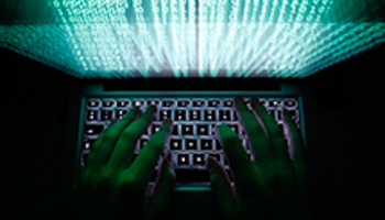 A man types on a computer keyboard (Reuters/Kacper Pempel/Files)