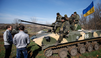 Pro-Russia protesters stand in front of Ukrainian soldiers in eastern Ukraine (Reuters/Marko Djurica)