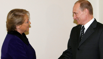 Russian Prime Minister Vladimir Putin shakes hands with Chile's President Michelle Bachelet during their meeting at his residence of Novo-Ogaryovo, outside Moscow (Reuters/Denis Sinyakov)