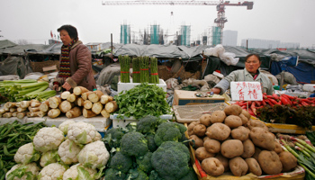 Vegetable vendors wait for customers in Beijing  (Reuters/Claro Cortes IV)